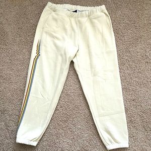 Patagonia women’s sweatpants, cream with rainbow wave on side. Size L, NWT!
